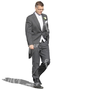 man in a fancy tuxedo walking