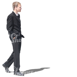 man in a black suit walking