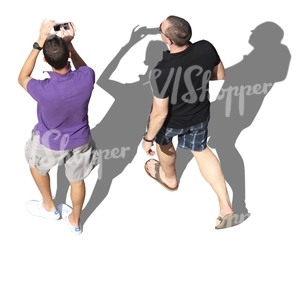 two men walking and taking pictures