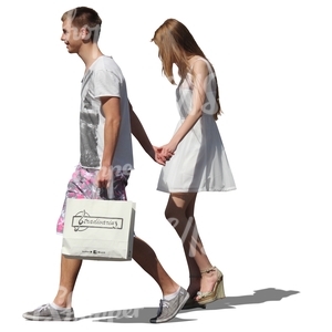 young couple with shopping bags walking hand in hand