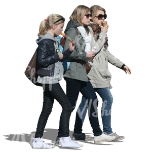 three girls walking and eating ice cream