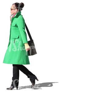 woman with a green coat walking