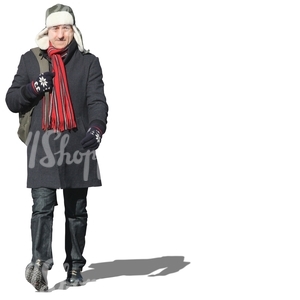 man with a red scarf walking