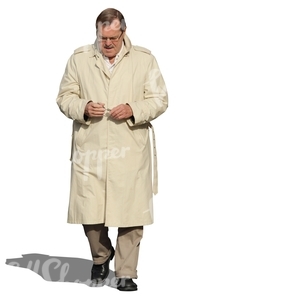 cut out man in a beige trenchcoat walking