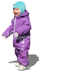 child in a purple onsie standing