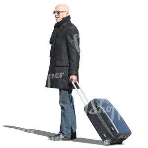 travelling man standing with a suitcase