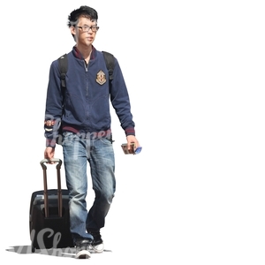 young asian man pulling a suitcase