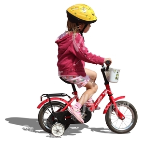 little girl with helmet riding a bike