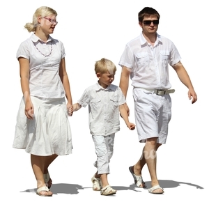 family dressed in white walking hand in hand
