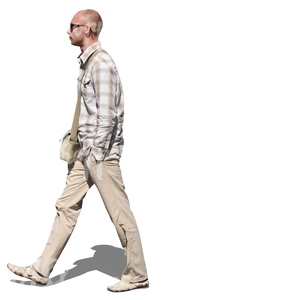 cut out man in a beige outfit walking