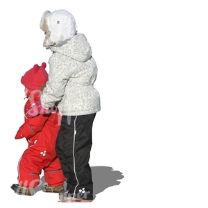 girl standing with her little sister in winter