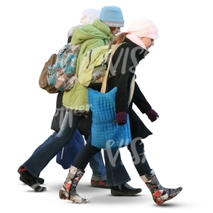 three cut out girls walking in winter