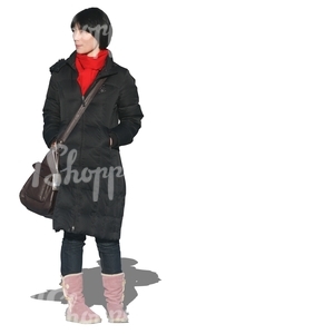 cut out woman in a black coat walking