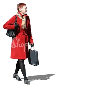 cut out woman in a red autumn coat walking