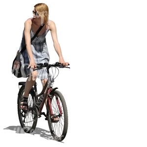 woman in a dress riding a bike