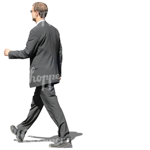 man in a grey suit walking