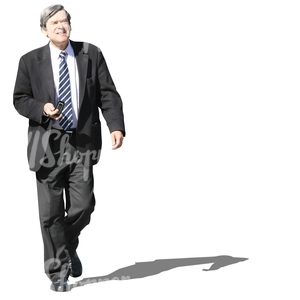 grey-haired businessman walking