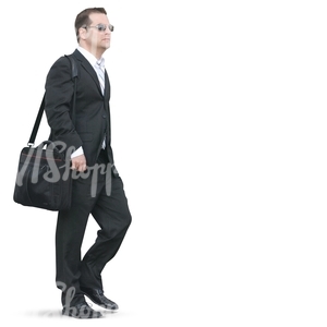 businessman walking with a bag over his shoulder