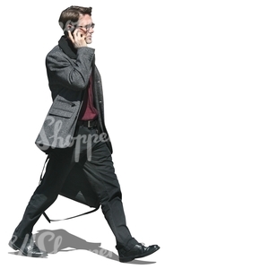 walking businessman talking on the phone