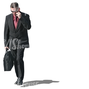 businessman with a briefcase talking on the phone