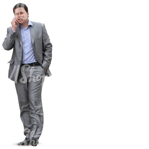 businessman in a grey suit talking on the phone