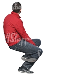 man in a red jacket sitting