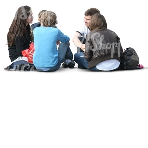 four cut out people sitting on the ground