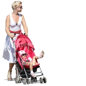 woman in a dress pushing a stroller