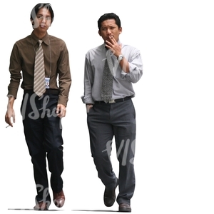 two asian businessman walking and smoking