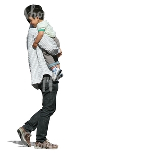 asian man walking and carrying his son 