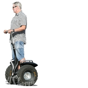 grey-haired man riding a segway