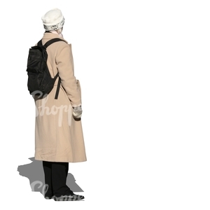 woman in a beige autumn coat standing