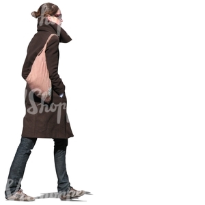 woman in a brown coat walking