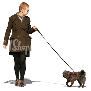 woman walking with a small dog