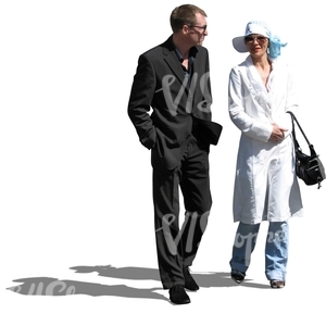 formally dressed man and woman walking