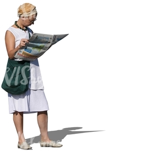 woman standing and reading a newspaper