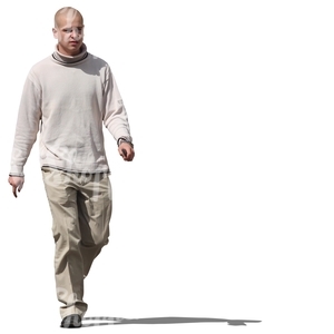 young bald man walking
