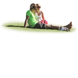 man and woman sitting on the grass