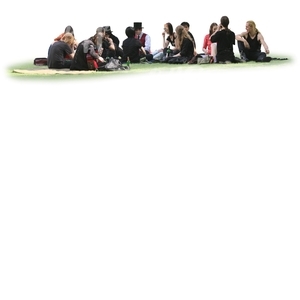 large group of people sitting together on the grass