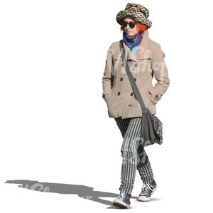 woman in a hat and coat walking