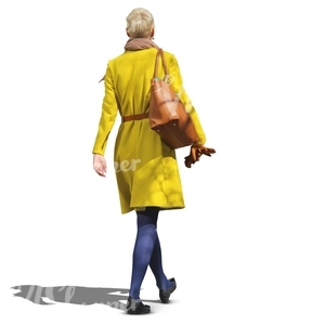 woman in a yellow coat walking