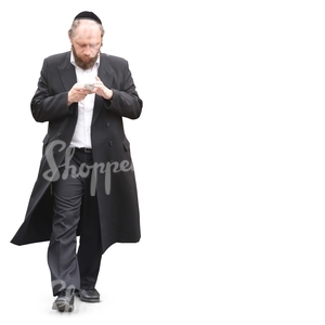 Jewish man walking and looking at his smartphone