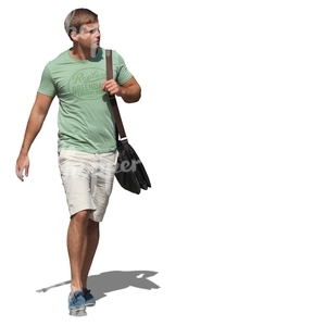 man in a green t-shirt walking