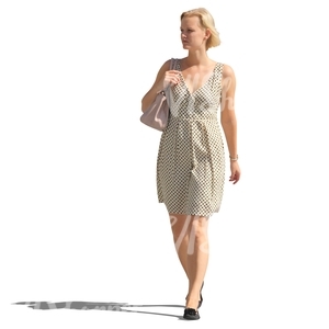 blond woman in a white dress walking on the street