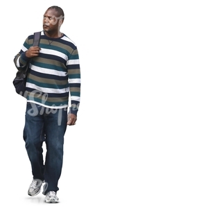 black man in a striped sweater walking
