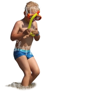 boy with a snorkeling mask standing in the water