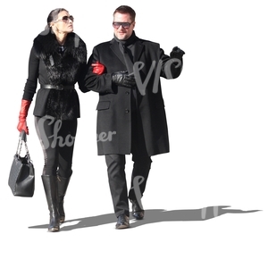 posh couple dressed in black walking arm in arm