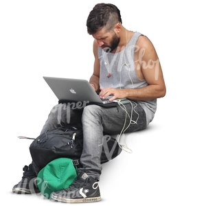 man sitting and working on his computer