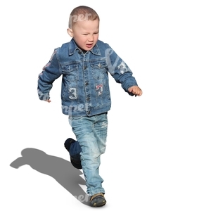 little boy in a denim outfit running around