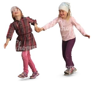 two smiling girls walking hand in hand
